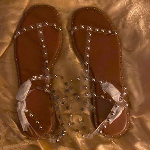 Brand new never worn shoes. They are beautiful studded sandals.